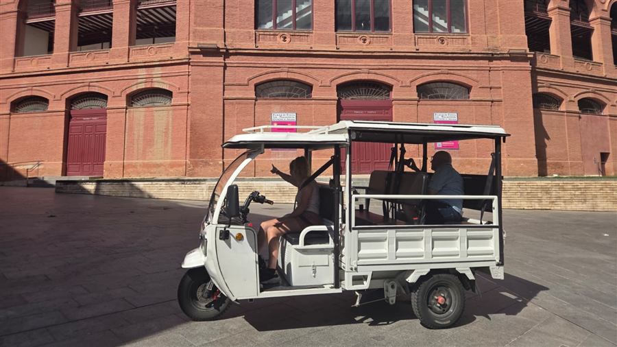 Electric tuk tuk in front of La Malagueta Bullring, Málaga